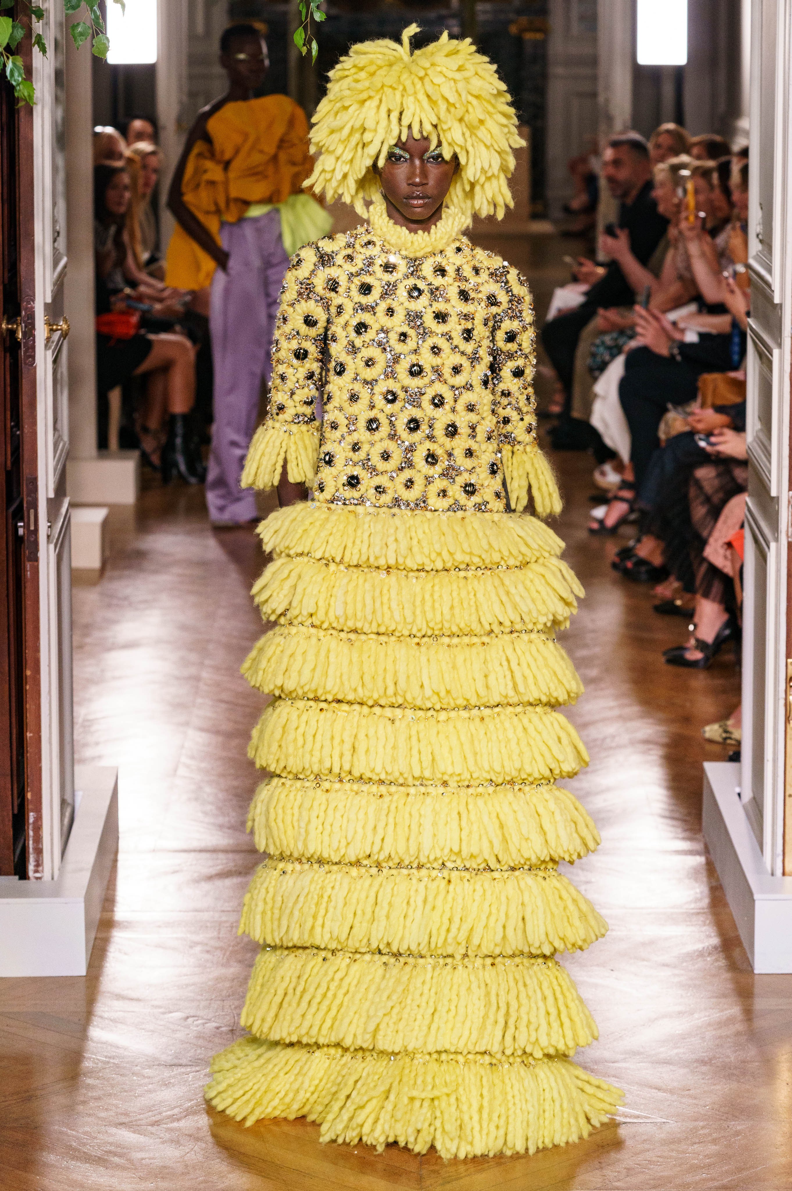 Round eyes because "bride" wearing "wedding dress".