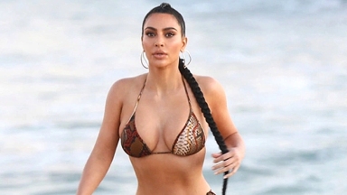 Kim Kardashian Slays In Pink String Bikini As She Poses By The Pool