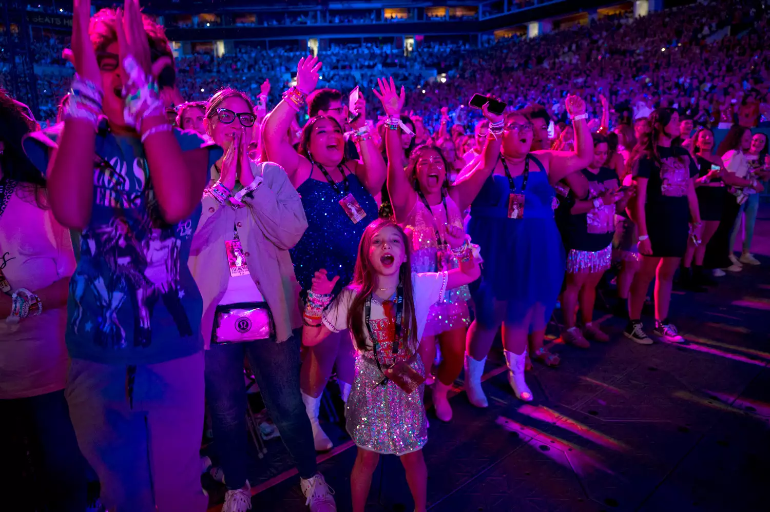 Taylor Swift fans watching the singer in Miami in October 2024