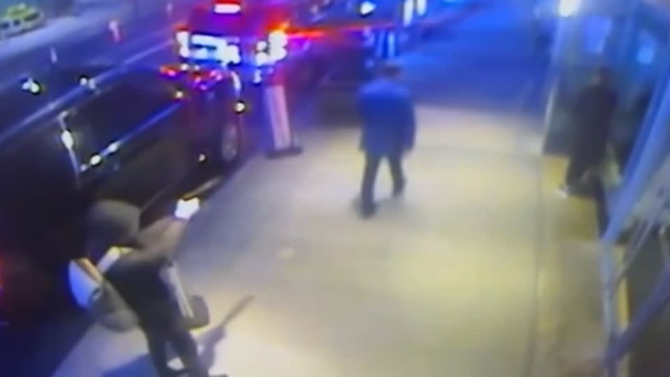 A gunman prepares to fatally shoot UnitedHealthcare CEO Brian Thompson from behind in New York. - Obtained by TSHIRTCLASSIC